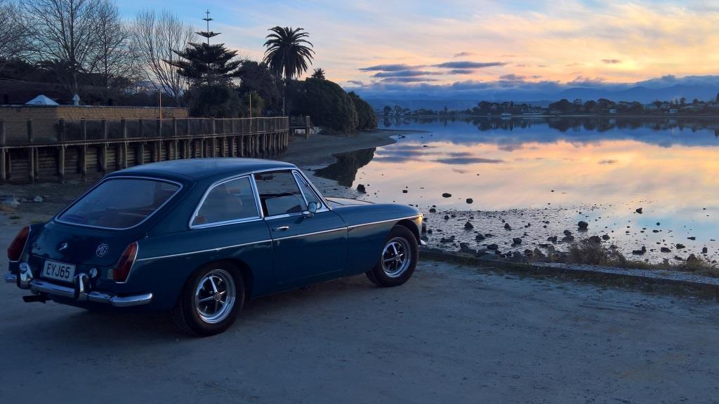 1972 MG BGT by sea at sunset
